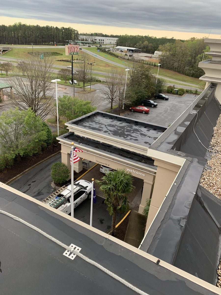 Commercial low-slope roof and canopy membrane during a repair visit
