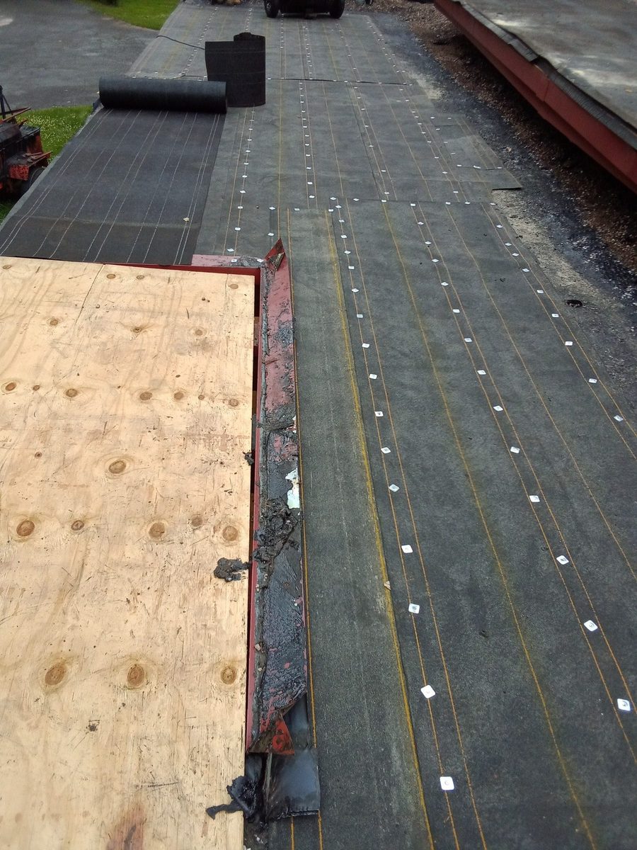 Flat roof repair with new plywood deck and fastened membrane